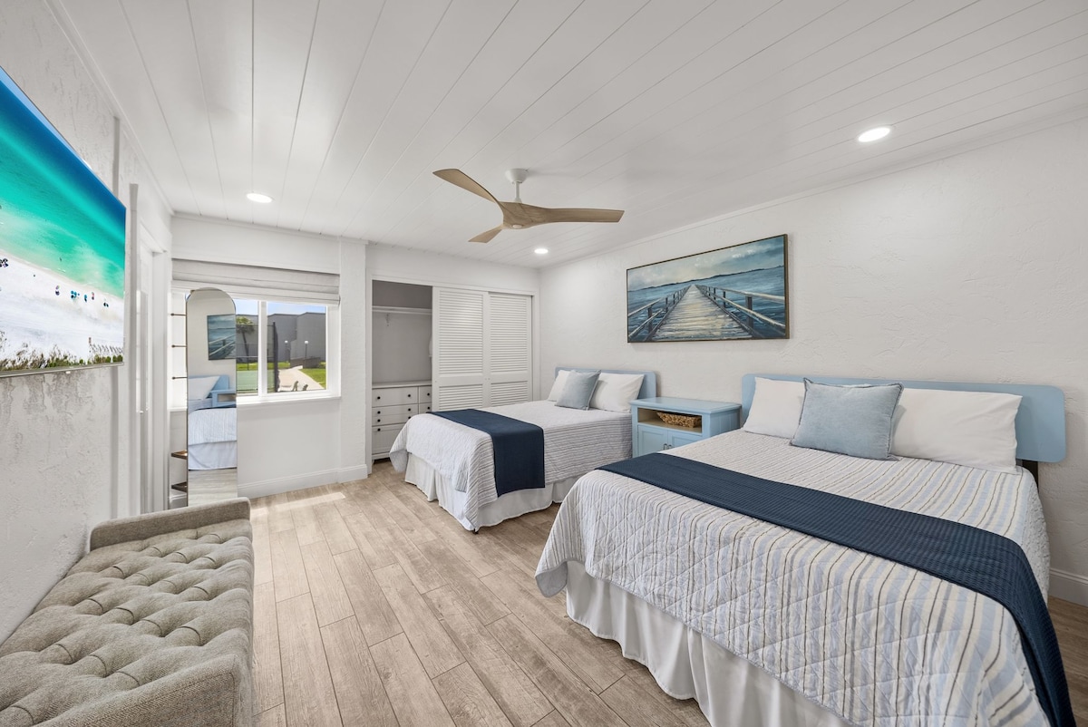 Secondary bedroom with 2 Full Size beds to fit 4 people. Smart TV in this room as well- shiplap ceiling with fan and dimmable lights.