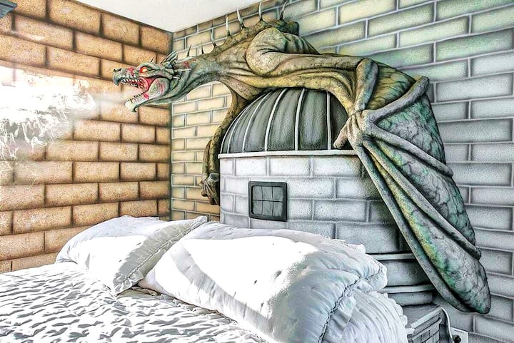 Up close the Gringotts Ukrainian Ironbelly fills the wall — scaled wings spread wide, claws gripping a stone turret above your pillow. It smokes. It roars. Even the grown-ups pause in the doorway.