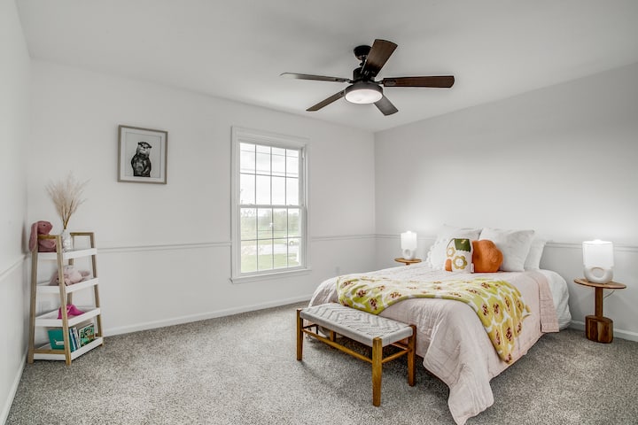 Comfortable and inviting bedroom with soft natural light, cozy bedding, and peaceful design creating the perfect space to relax and recharge during your stay.