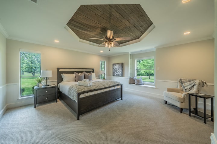Masterful Bedroom 2: Hexagon Wood Ceiling, Window Seat & Lush Green Views