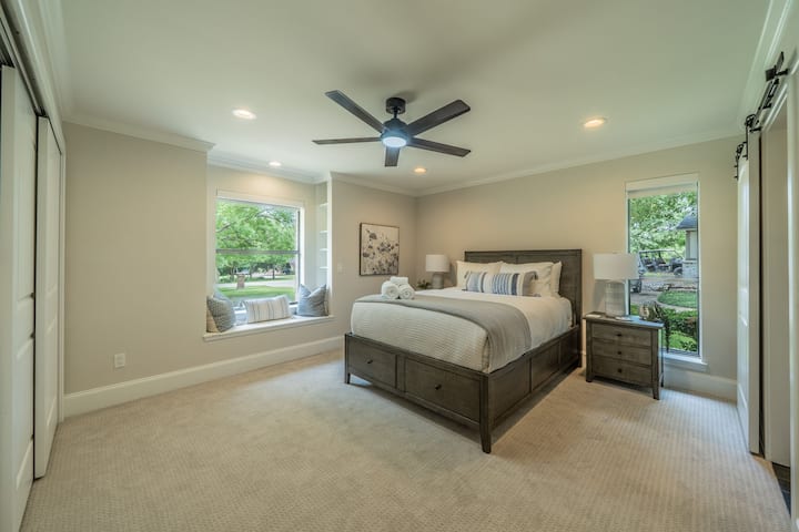 Serene Guest Suite: Window Seat, Garden Views & Modern Black Accents
