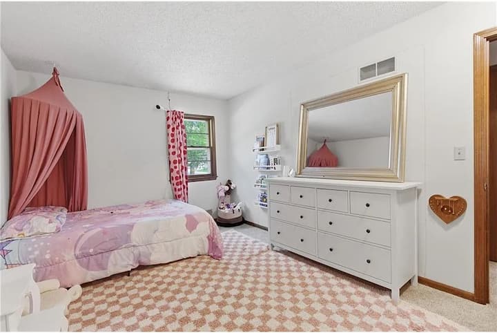 Charming and cozy bedroom with soft natural light, stylish furnishings, and a peaceful relaxing atmosphere.