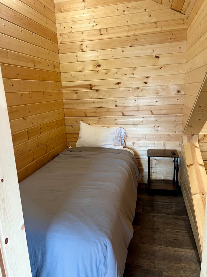 Twin bed with nightside and closet