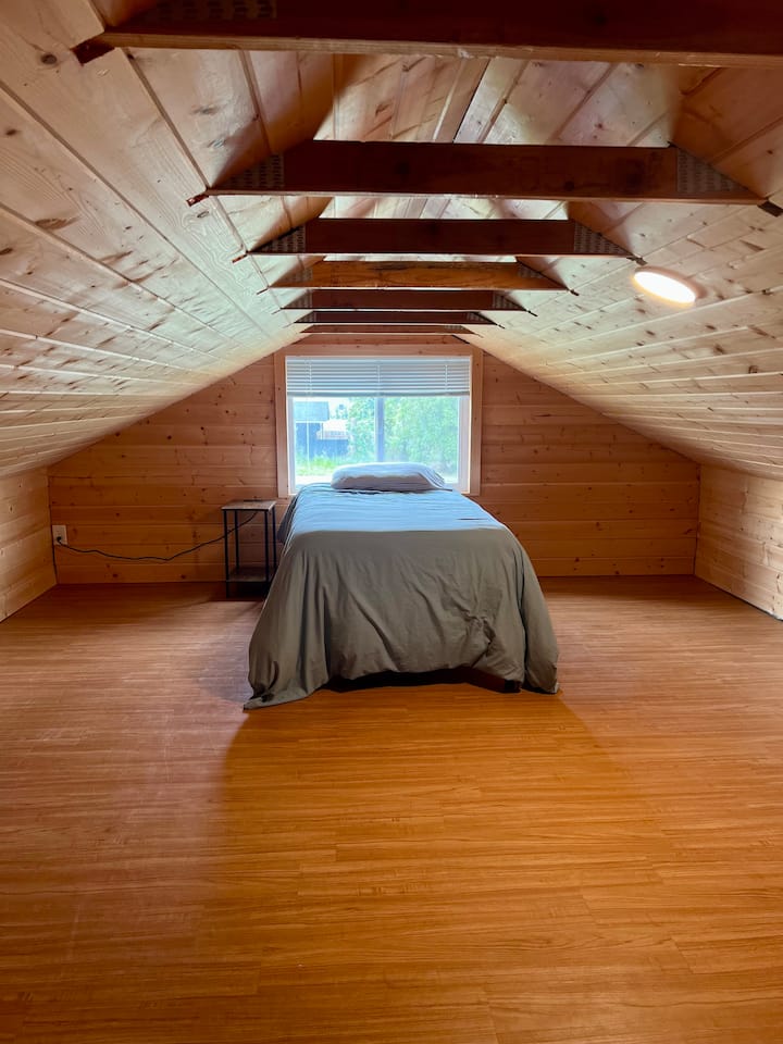 Twin bed in bedroom nook. Low ceilings so adults staying in this room would have to duck their heads, but it is a great space for kids!
