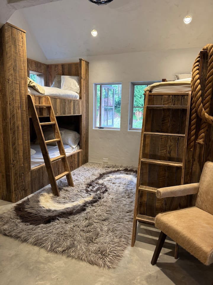 Bedroom 5: Four-person bunk room with walk-in closet, built-in desk, and shared full bath with Bedroom 4