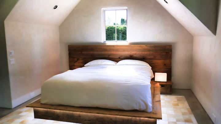 Bedroom 2 Upstairs Main House: Large Primary Suite with King bed, Saatva organic luxury mattress, all-natural 100% cotton luxury sheets, circular soaking tub, steam shower, double vanity, and walk-in closet