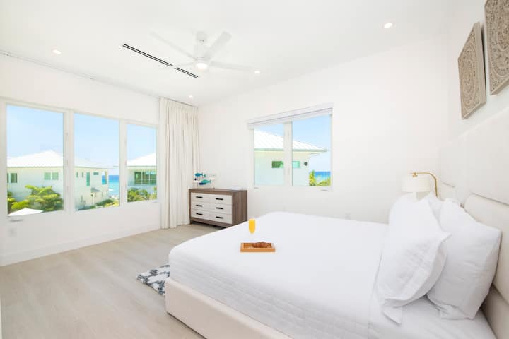 Bedroom 2 with partial ocean views and a king bed.