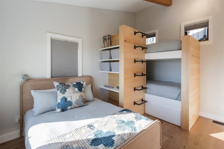 Bunk room with queen bed and bunk beds