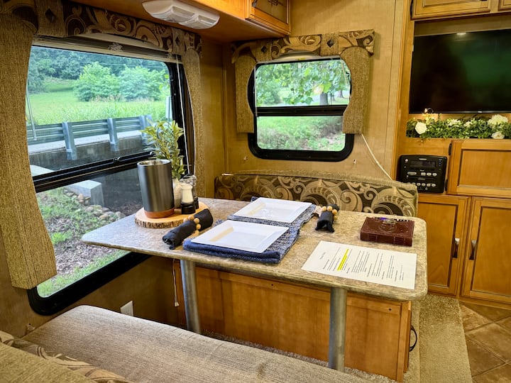 Dinette table with seating set for two upon arrival. Table also has a wine cooler, salt $ pepper, TV remote, guest book, and house rules. Please read house rules.