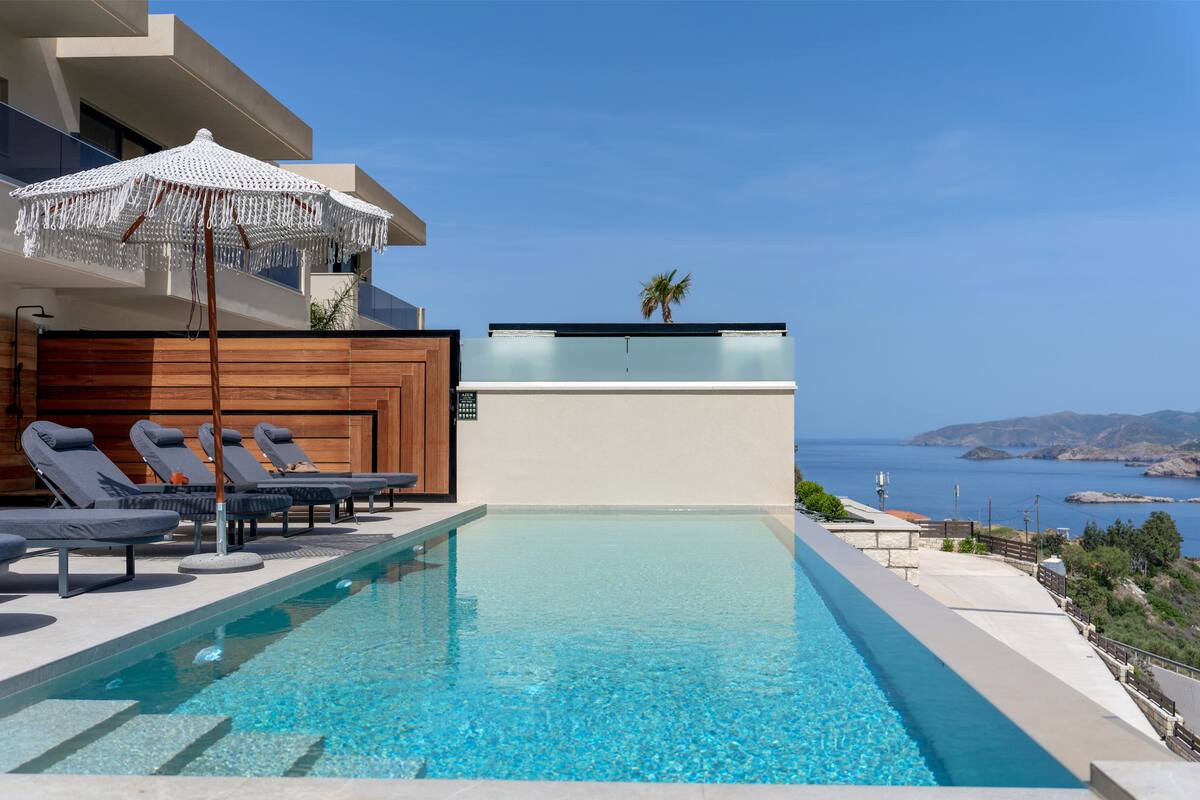 Pools, terraces and outdoor dining at AZUR Luxury Villas