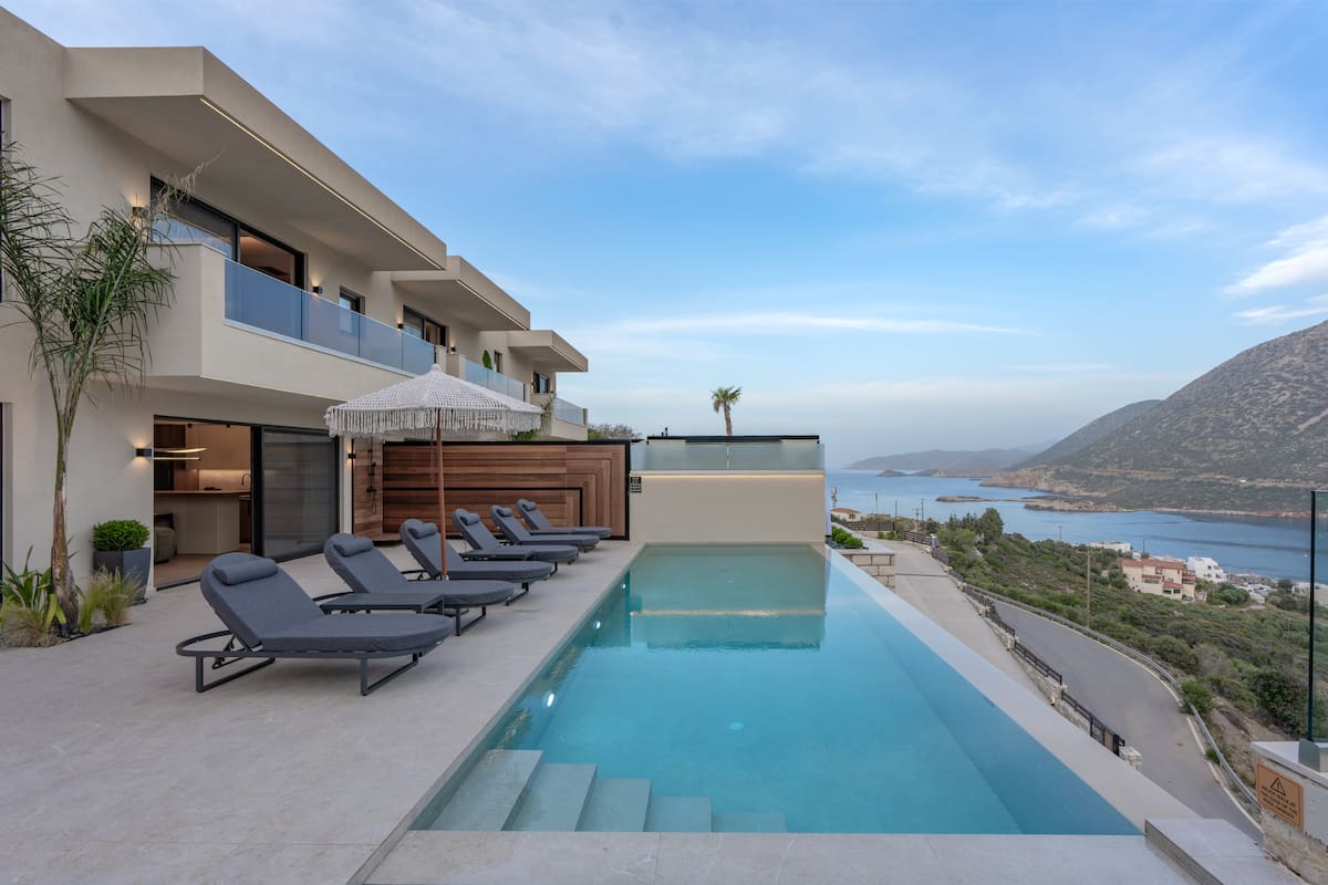 Pools, terraces and outdoor dining at AZUR Luxury Villas