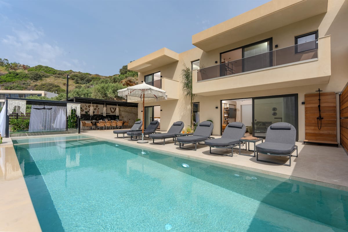 Pools, terraces and outdoor dining at AZUR Luxury Villas