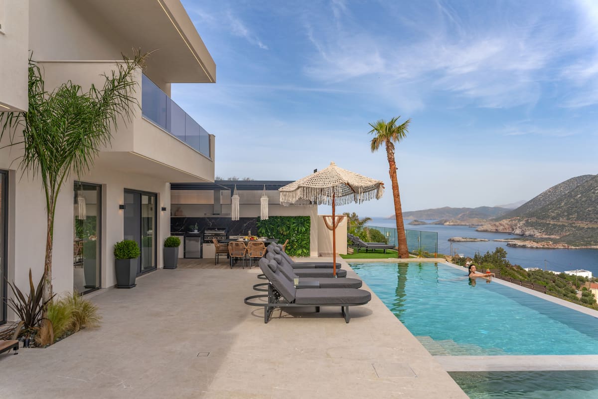 Pools, terraces and outdoor dining at AZUR Luxury Villas