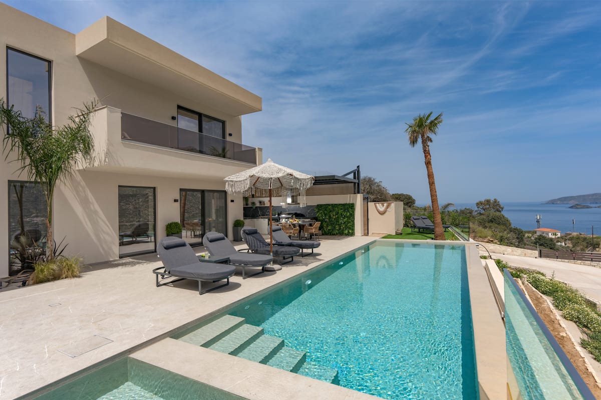 Pools, terraces and outdoor dining at AZUR Luxury Villas