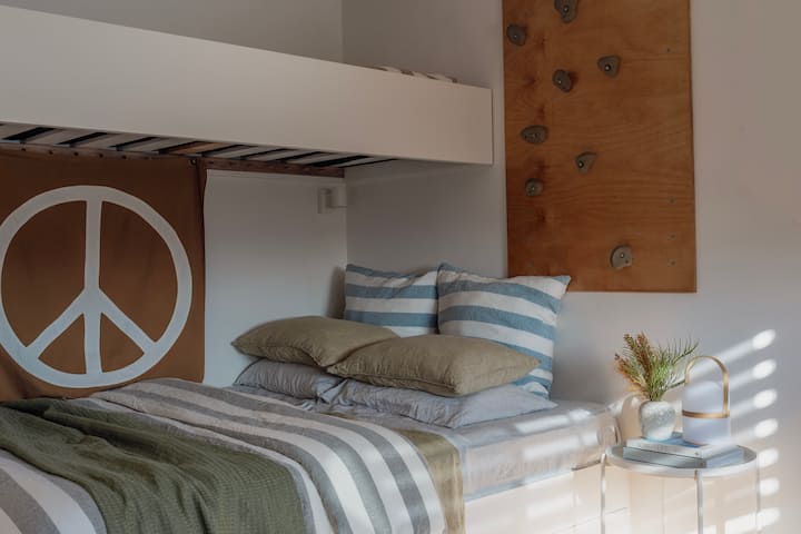 Custom-built bunk; Queen base with Single above.
