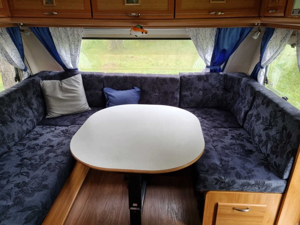Two luxuriously equipped XL mobile homes at a private dock with a boat