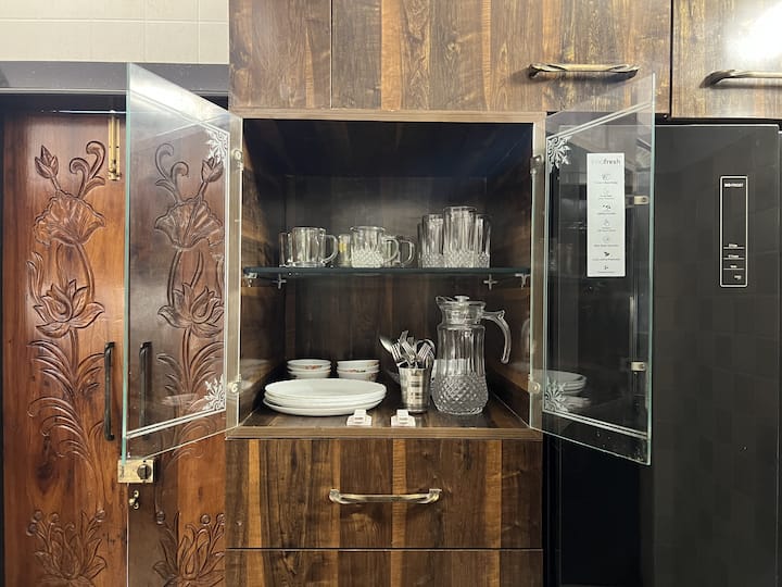 Cutlery and ceramic dinnerware are displayed for your use. If there are kids around, we've also placed durable melamine dinnerware for your use.