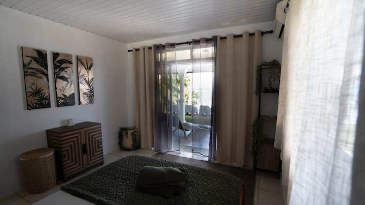 Smaller of the two bedrooms: wake up to the ocean view and enjoy a good night's sleep with air conditioning.
