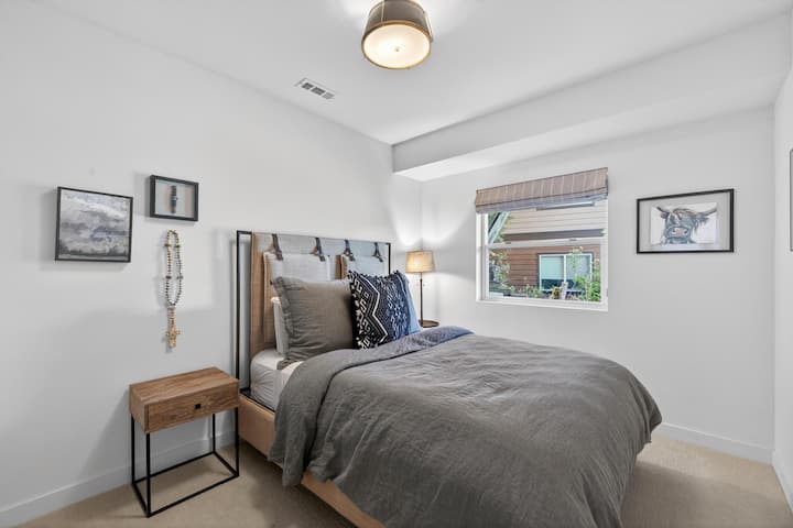 Comfortable lower-level queen bedroom.