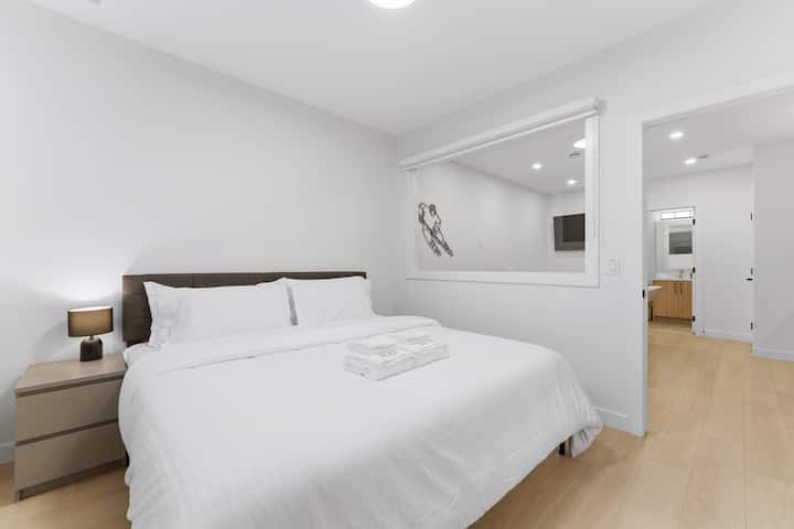 Basement bedroom with King bed. Memory foam mattress, memory foam pillows and a full attached walk in closet.