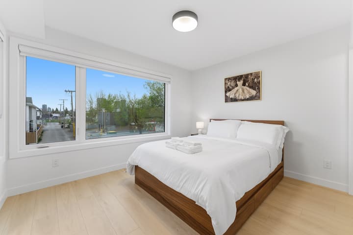 Second bedroom - Queen bed with memory foam mattress and memory foam pillows. Bright window for natural light with room darkening shades.
