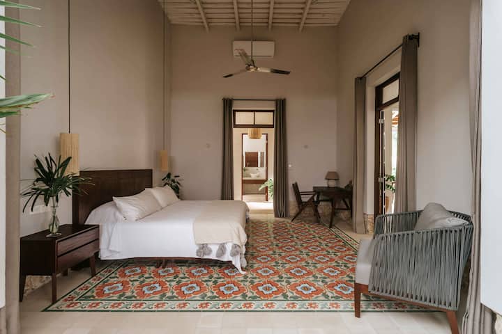 A beautiful blend of historic architecture, high ceilings, and calm contemporary comfort