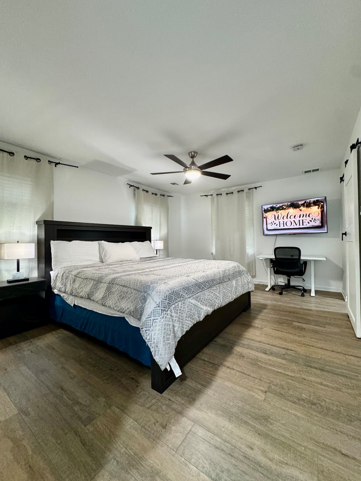 Comfortable guest bedroom with smart TV