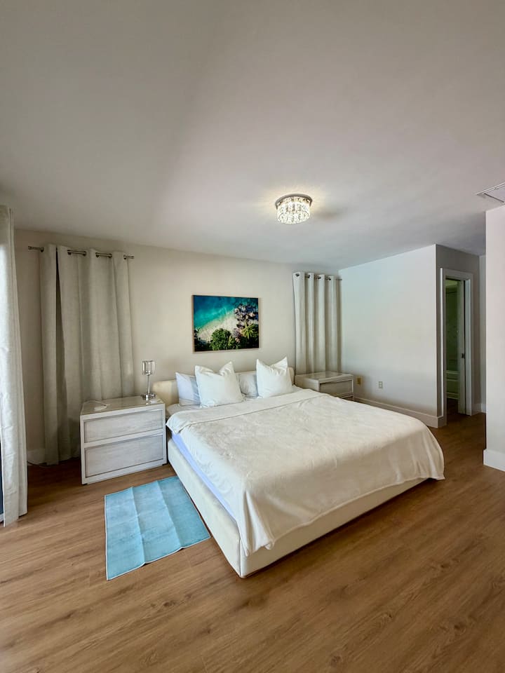 Master Bedroom with king memory foam bed with bamboo sheets. This room has its own bathroom with tub/shower. This room has a 55” TV.