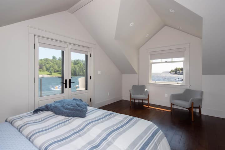 Secondary rooftop bedroom showing views of the Back Harbour and Mahone Bay.