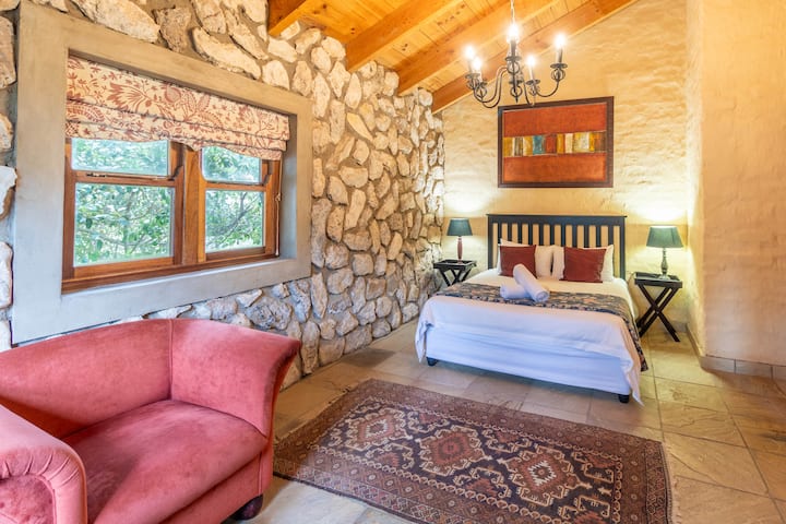 View from cupboard to the bed and side window