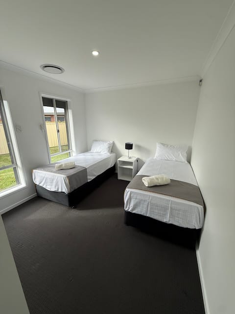 Bedroom 1 with two single beds