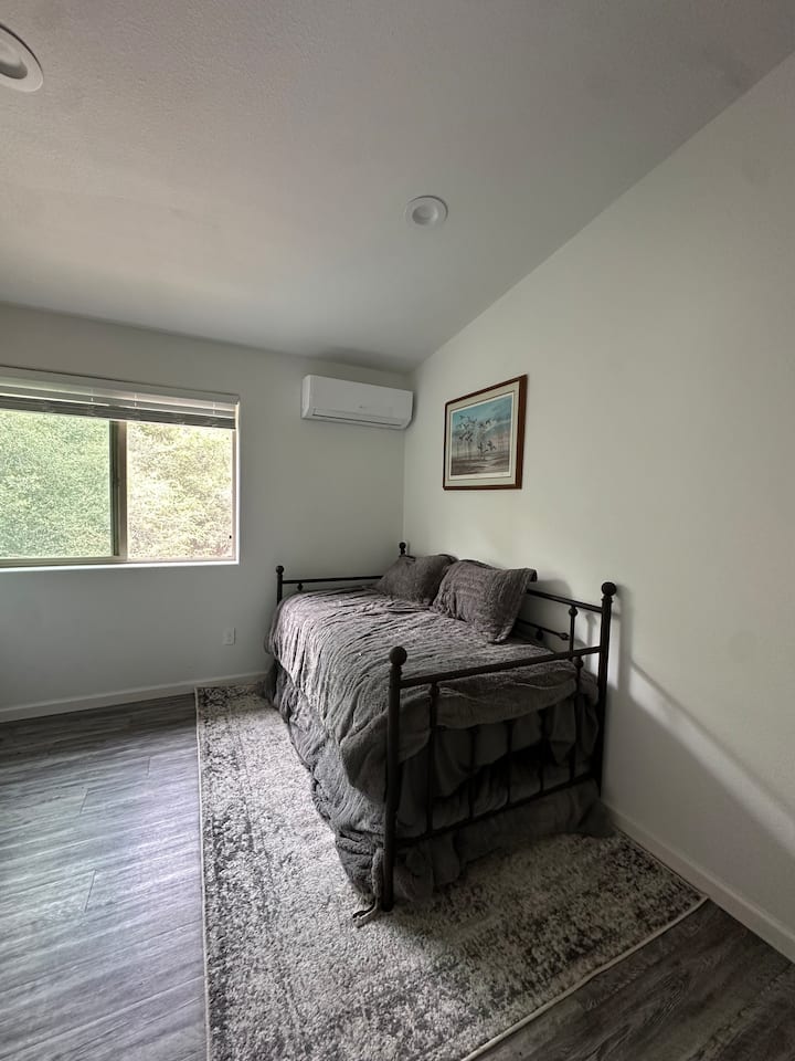 Bedroom 2 single bed, pull out single bed, and AC unit