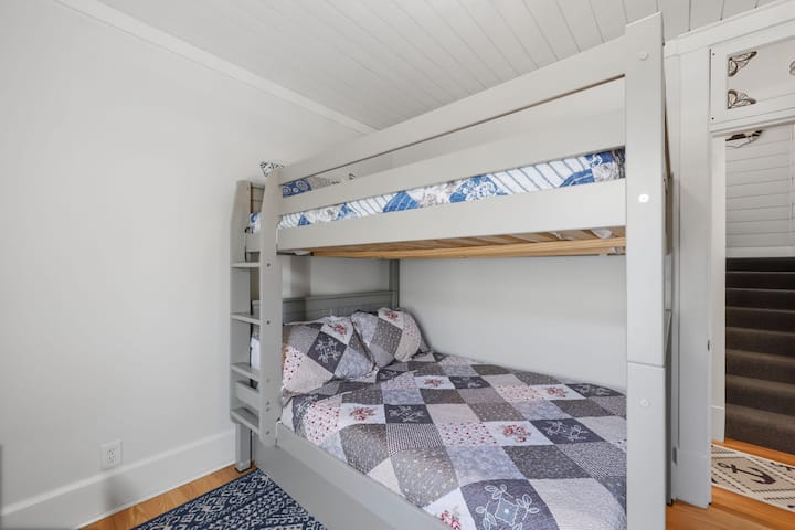 Perfect for families and groups, this second-floor suite features a full-over-full bunk bed with an additional twin trundle bed for extra sleeping space.