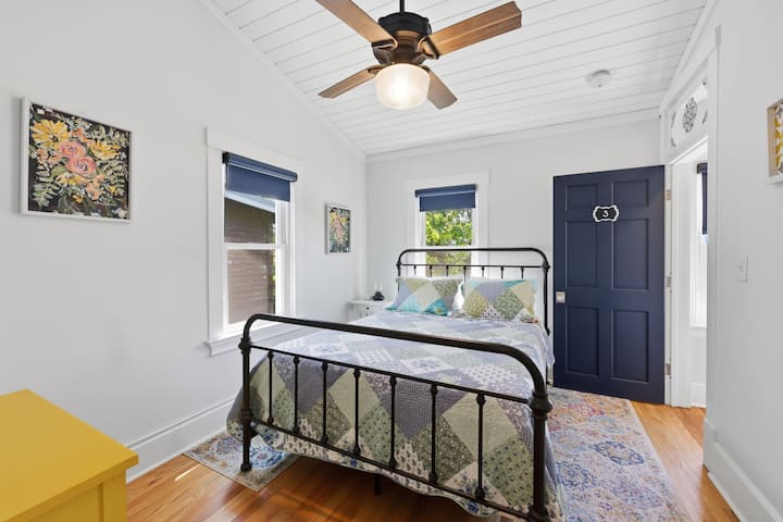 Bright and inviting "Suite 3", this second-floor suite features a comfortable queen bed, charming décor, and plenty of natural light for a restful stay.