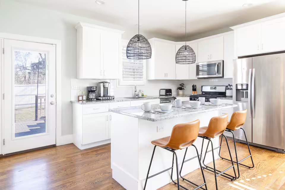 Chef's kitchen with pendant lighting and quartz island