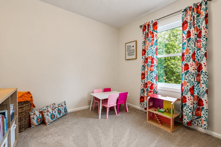Bright bedroom with space for kids to play, learn, and relax.
