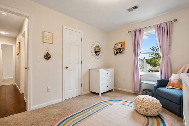 Sweet nursery retreat with calming colors and room to unwind.