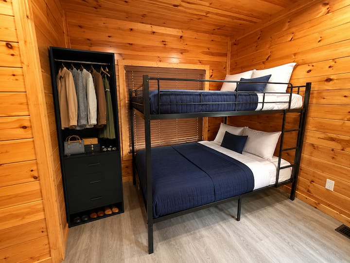 Queen-over-queen bunk bed in the game room, perfect for kids, teens, or extra guests at our Gatlinburg cabin.
