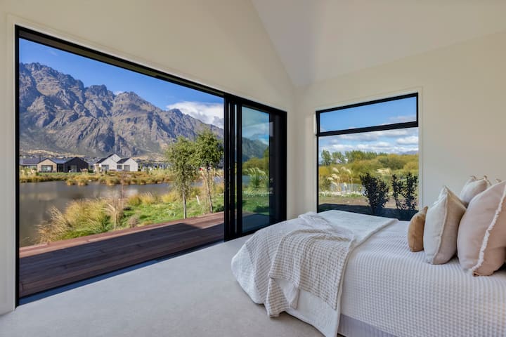 King bedroom with ensuite and waterfront outlook