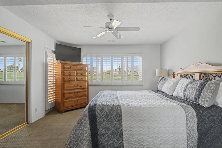 Primary bedroom with a king bed, en-suite bathroom and Smart TV for a comfortable retreat at the end of the day.