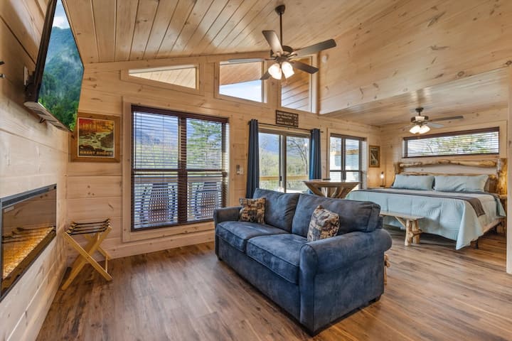 Living space with full kitchen, smart tv, dining, electric fireplace