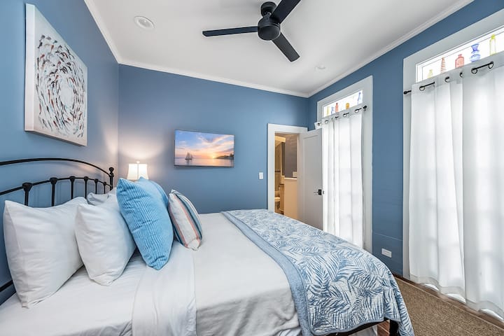Cozy queen bedroom with ceiling fan
