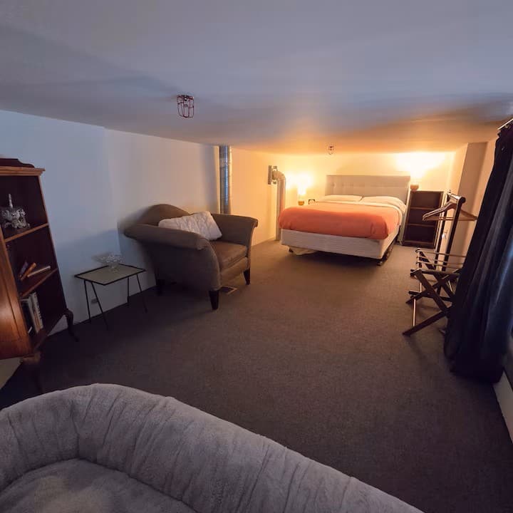 Cozy upstairs mezzanine bedroom with a double bed. Please note: this bedroom is accessed by stairs.