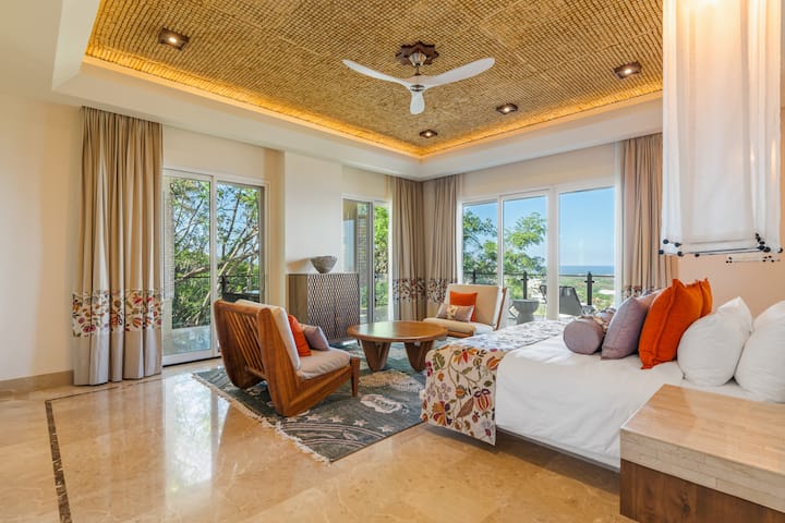 Main Floor Master Bedroom - Seating area, terrace view, patterned stone ceiling and marble floor
