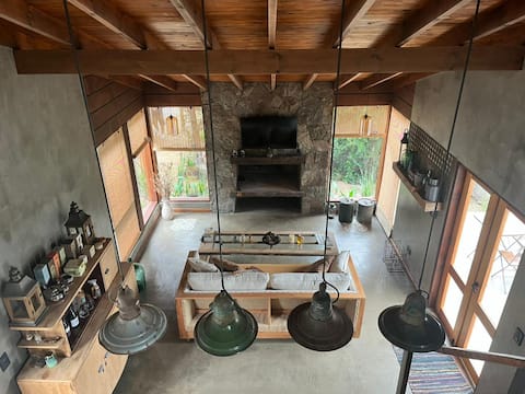 Popular Airbnb listing: La Fuga | Designer loft among trees and by the river in Villa Yacanto De Calamuchita