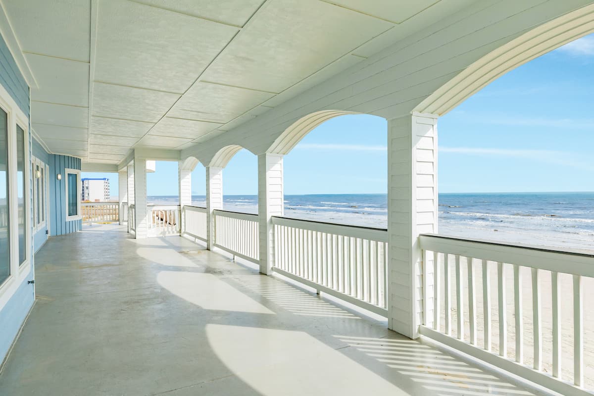 Covered balcony with ocean view and coastal breeze