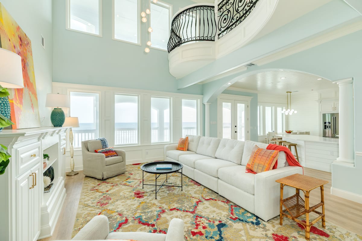 Spacious living room with high ceilings and natural light