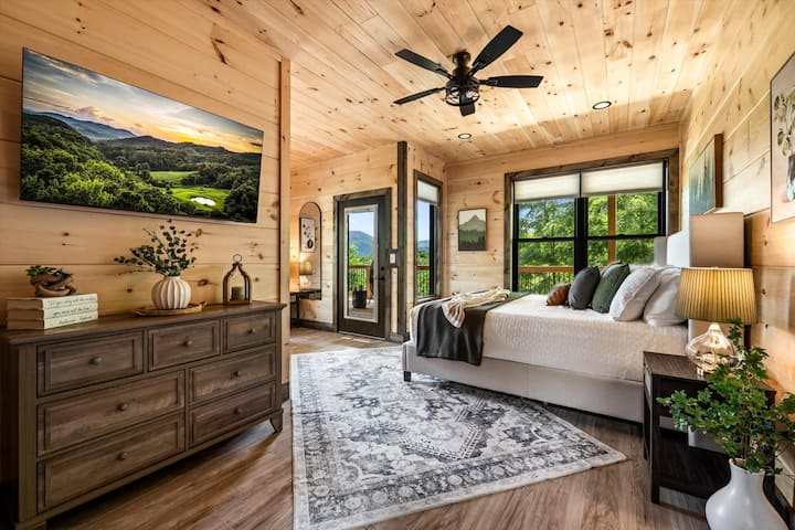 King suite with a private ensuite and walk-in shower — one of two on the main floor.