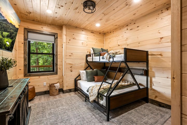 Twin-over-queen bunk room with its own full bath and tub, ideal for the kids or a third couple.