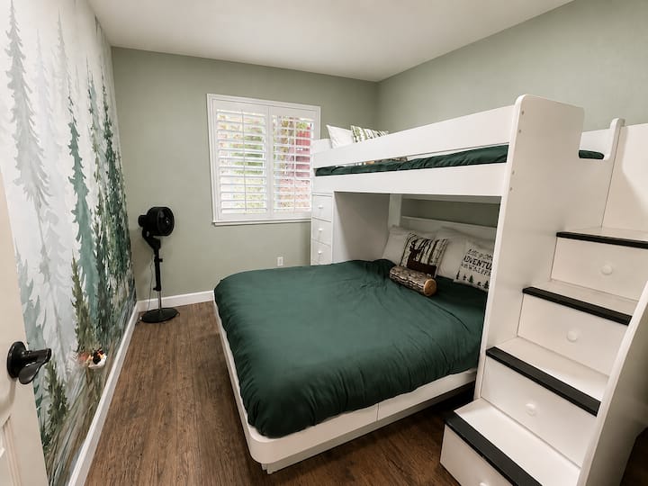 If you're staying with children, they will love this bunk room! With a queen-size bed and a single bed on top of the stairs, it's perfect for three guests.